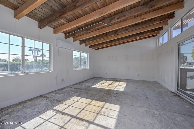 6312 N 13th St, Phoenix, AZ 85014 - spare room with a wall mounted AC, wooden ceiling with exposed beams, and baseboards