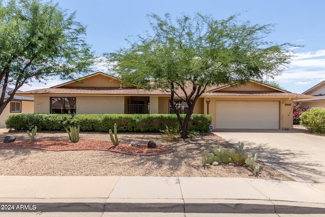 ranch-style house featuring a garage