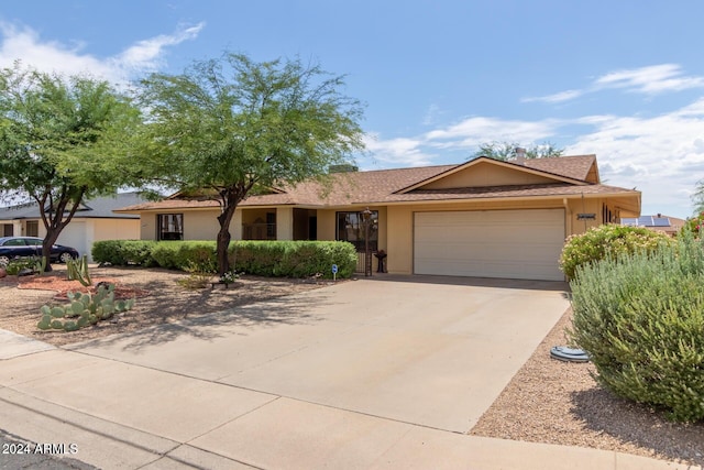 single story home featuring a garage