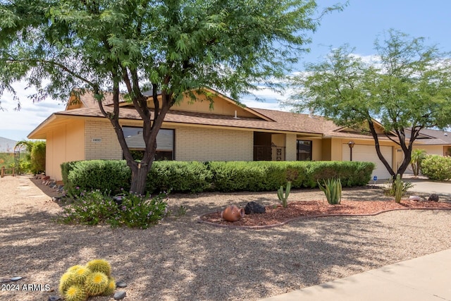 ranch-style home with a garage