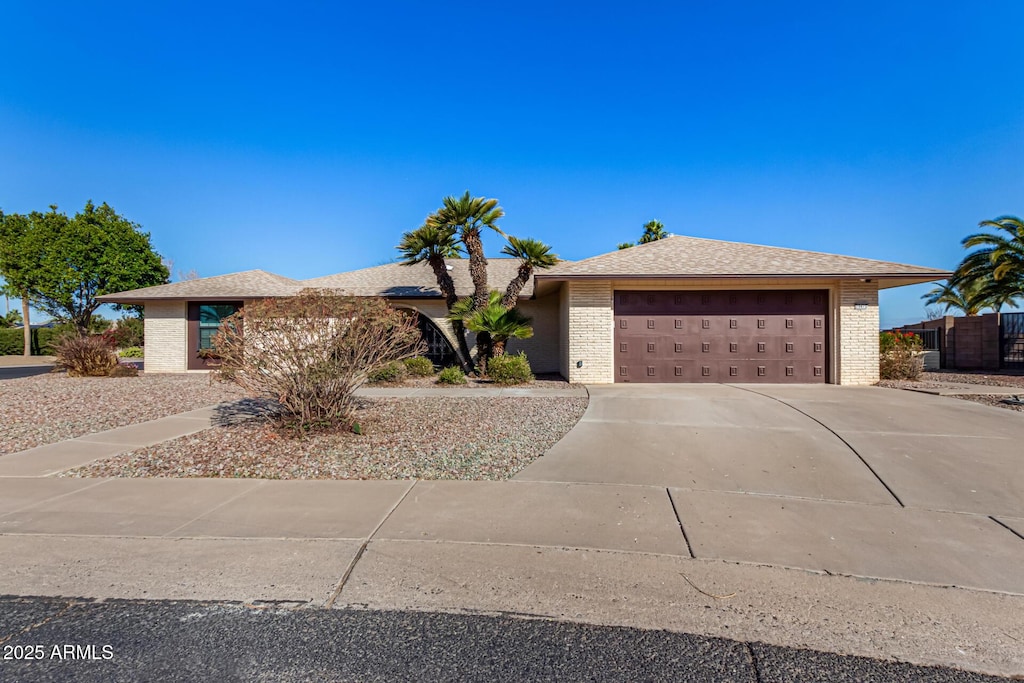 ranch-style house featuring a garage