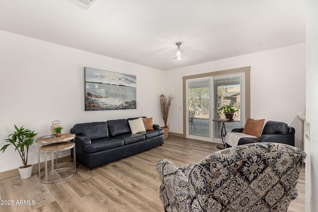 living room with light hardwood / wood-style floors