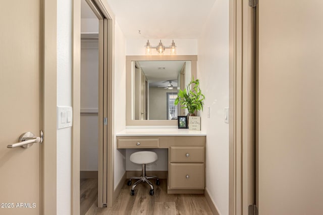 bathroom with hardwood / wood-style floors and vanity