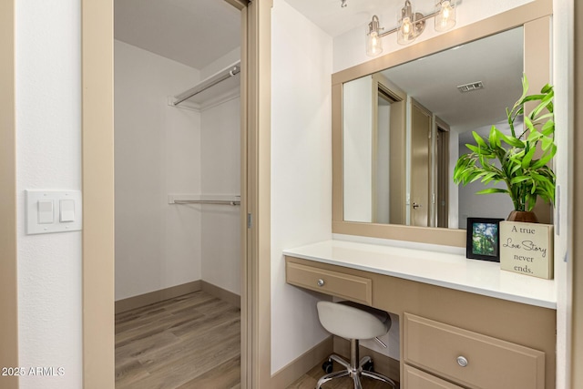 bathroom with vanity and wood-type flooring