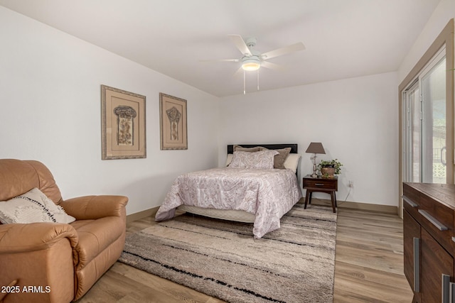 bedroom featuring light hardwood / wood-style flooring and ceiling fan