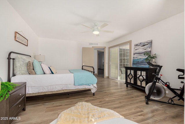 bedroom with light hardwood / wood-style floors and ceiling fan