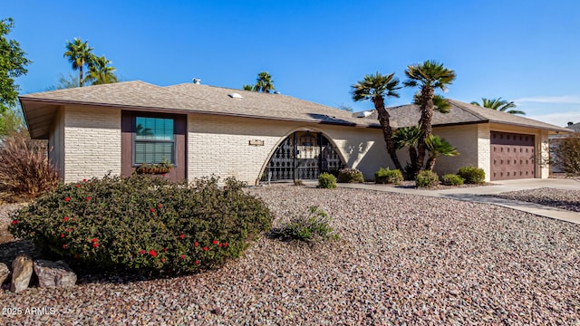 ranch-style home featuring a garage