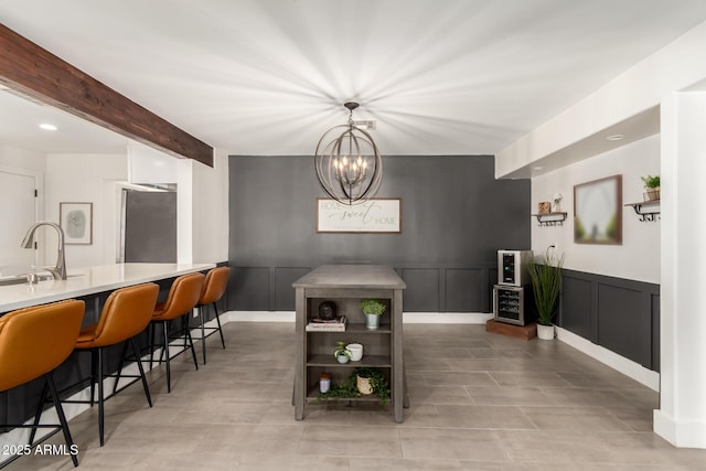 3038 E Avalon Dr, Phoenix, AZ 85016 - dining room with a decorative wall, a chandelier, beam ceiling, and recessed lighting