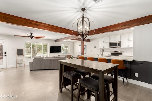 3038 E Avalon Dr, Phoenix, AZ 85016 - dining space featuring beam ceiling, a chandelier, ceiling fan, and recessed lighting
