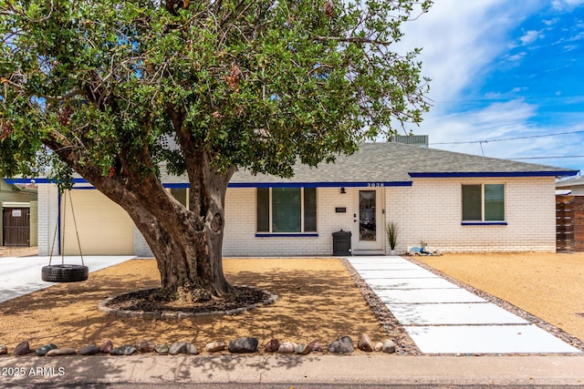 3038 E Avalon Dr, Phoenix, AZ 85016 - single story home with brick siding, roof with shingles, and driveway