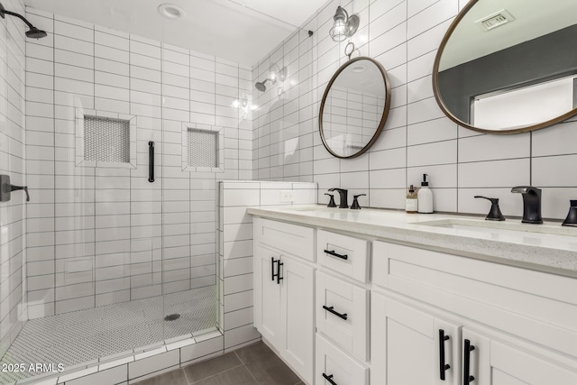 3038 E Avalon Dr, Phoenix, AZ 85016 - full bath with a shower stall, double vanity, tile walls, and backsplash
