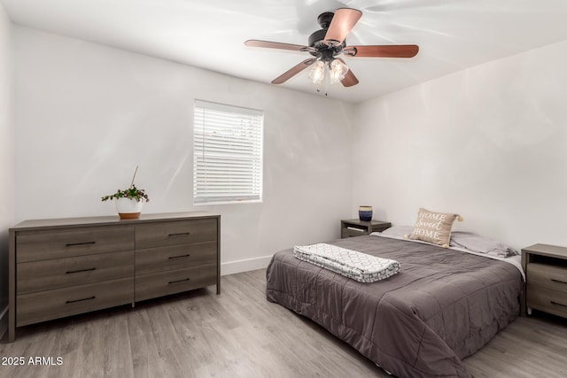 3038 E Avalon Dr, Phoenix, AZ 85016 - bedroom with wood finished floors, baseboards, and ceiling fan