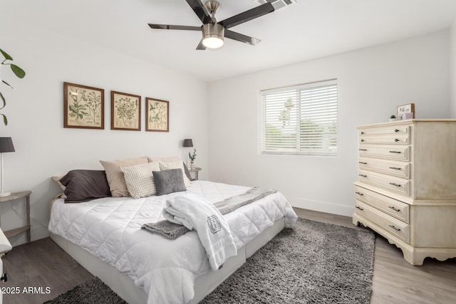 3038 E Avalon Dr, Phoenix, AZ 85016 - bedroom featuring light wood-type flooring, a ceiling fan, and baseboards