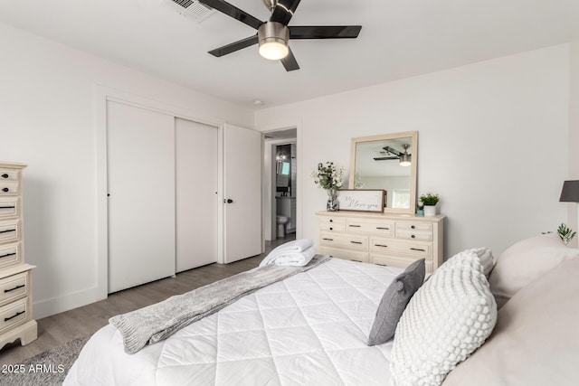3038 E Avalon Dr, Phoenix, AZ 85016 - bedroom featuring wood finished floors, a closet, and ceiling fan
