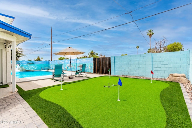 3038 E Avalon Dr, Phoenix, AZ 85016 - fenced backyard featuring a putting area and a patio area