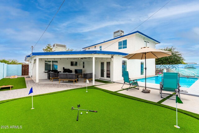3038 E Avalon Dr, Phoenix, AZ 85016 - rear view of property with a putting green, french doors, and a patio