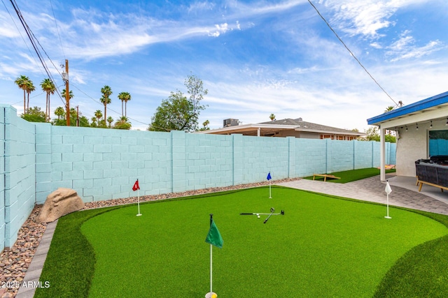 3038 E Avalon Dr, Phoenix, AZ 85016 - fenced backyard featuring a putting green and a patio area