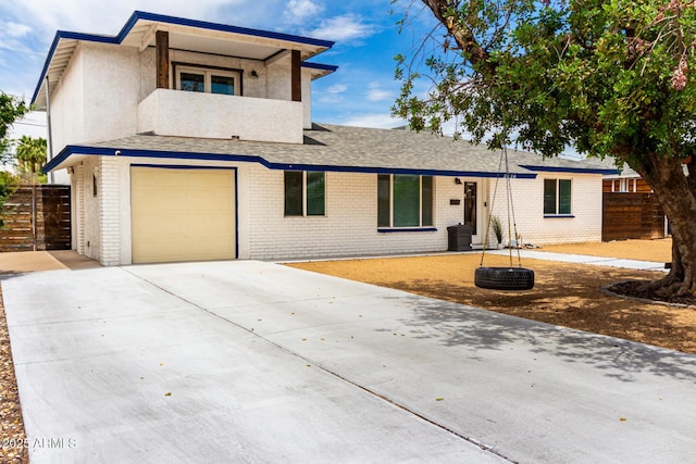 3038 E Avalon Dr, Phoenix, AZ 85016 - view of front facade featuring brick siding, driveway, and a garage