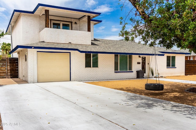3038 E Avalon Dr, Phoenix, AZ 85016 - view of front of house featuring brick siding, concrete driveway, and a garage
