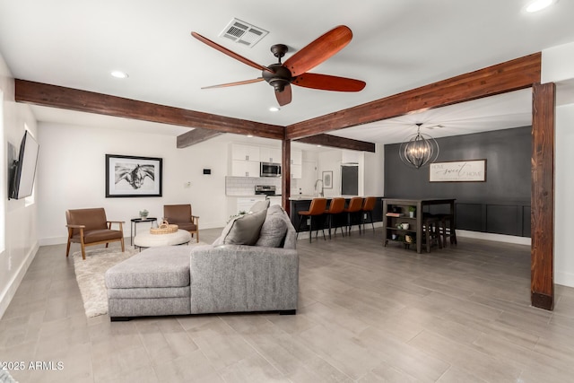 3038 E Avalon Dr, Phoenix, AZ 85016 - living area featuring beamed ceiling, recessed lighting, a ceiling fan, a chandelier, and baseboards