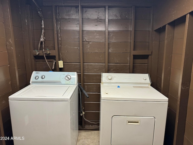 clothes washing area with washing machine and clothes dryer