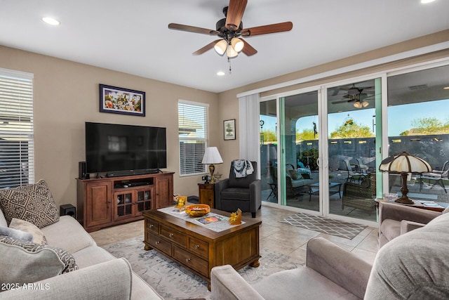 living room featuring ceiling fan and light tile patterned flooring