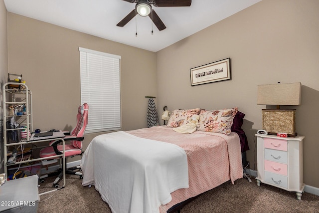 bedroom with ceiling fan and dark colored carpet