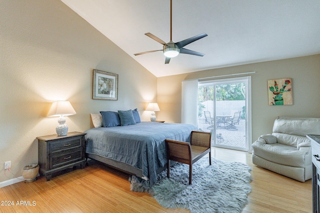 bedroom featuring ceiling fan, vaulted ceiling, light hardwood / wood-style floors, and access to exterior