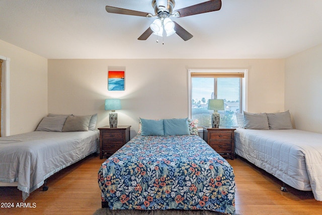 bedroom featuring ceiling fan and light hardwood / wood-style flooring