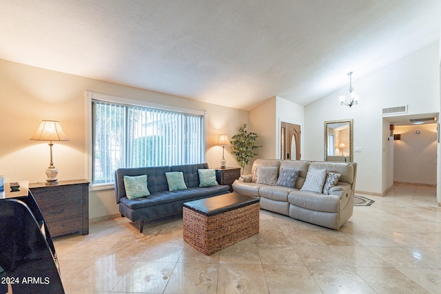 living room with lofted ceiling and a notable chandelier