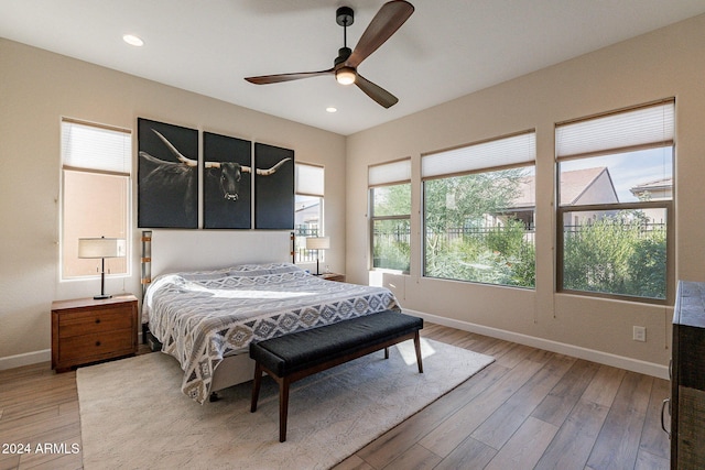 bedroom with wood-type flooring and ceiling fan