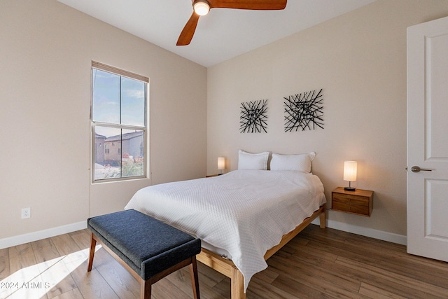 bedroom featuring ceiling fan and dark hardwood / wood-style flooring