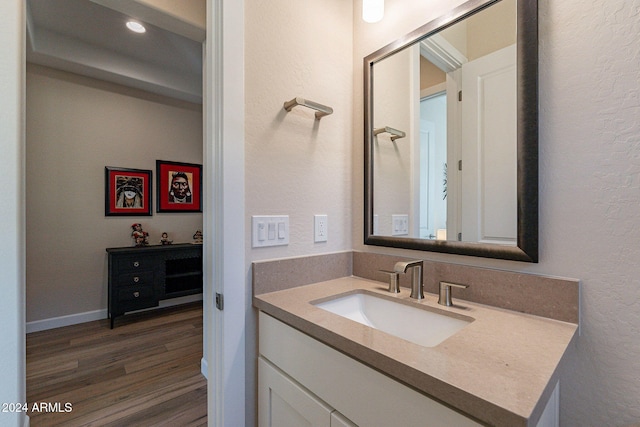 bathroom featuring vanity and hardwood / wood-style flooring