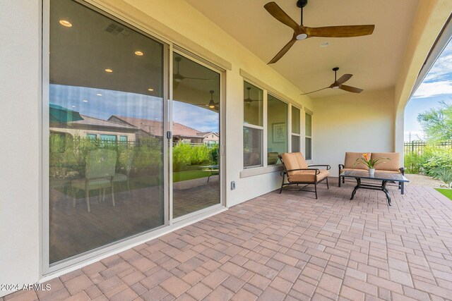 view of patio featuring ceiling fan