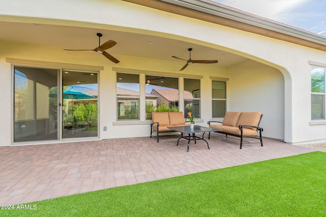 view of patio featuring ceiling fan