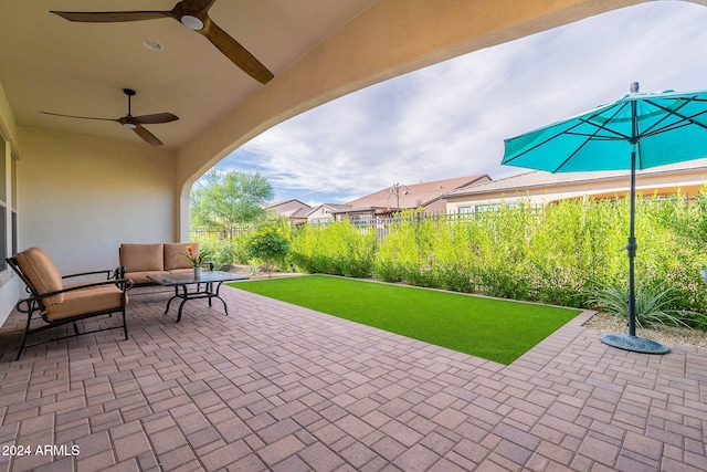 view of patio featuring ceiling fan