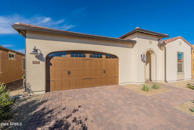 view of front of property with a garage