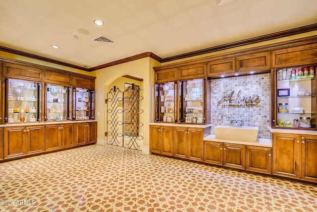 bar featuring crown molding