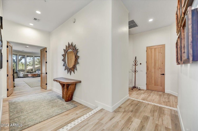 hall featuring light hardwood / wood-style flooring