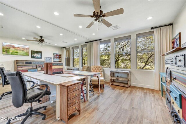 office space featuring ceiling fan and light hardwood / wood-style flooring