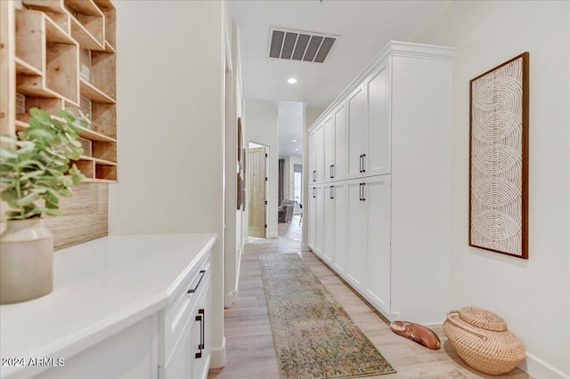 corridor featuring light hardwood / wood-style floors