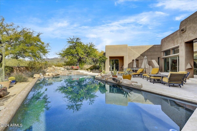 view of pool featuring a patio