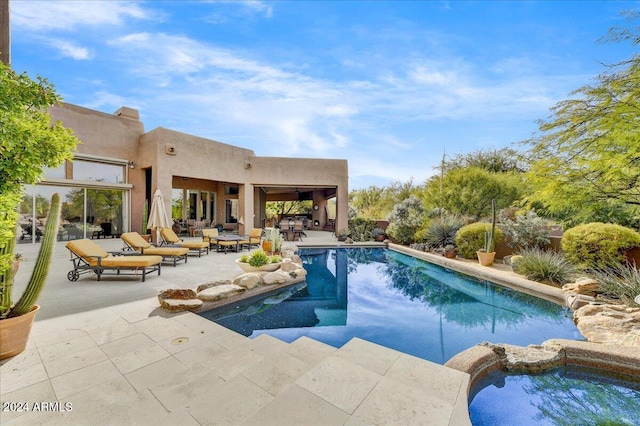 view of pool featuring a patio