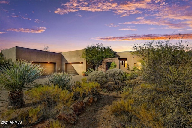 adobe home with a garage