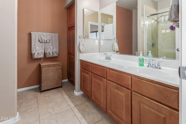 bathroom featuring vanity, an enclosed shower, and tile patterned floors