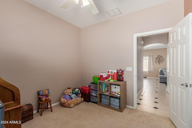 recreation room featuring ceiling fan and light colored carpet