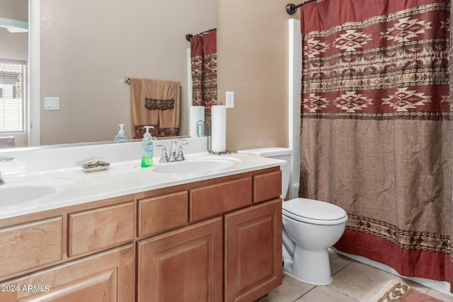 bathroom with vanity, tile patterned floors, and toilet