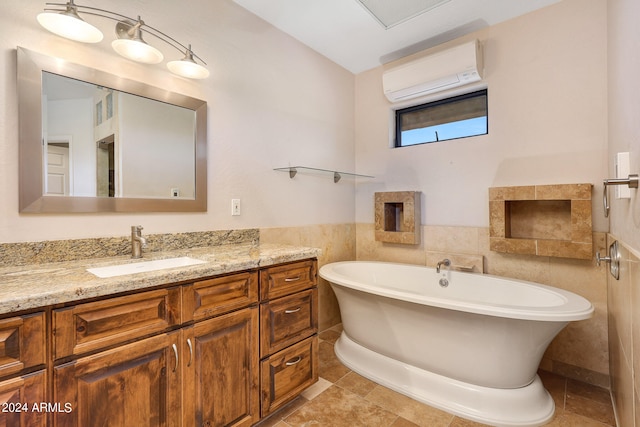 bathroom featuring vanity, a bath, tile patterned flooring, tile walls, and a wall unit AC