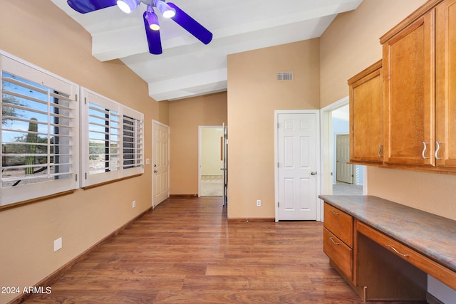 kitchen with ceiling fan, lofted ceiling with beams, and dark hardwood / wood-style floors