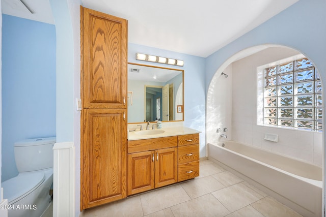 full bathroom with tile patterned floors, shower / washtub combination, vanity, and toilet